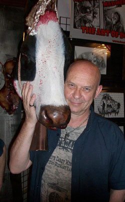 Doug Bradley, best known for his role as the Lead Cenobite Pinhead in the Hellraiser film series, with his Cow Head Prop from Pumpkin Pulp.